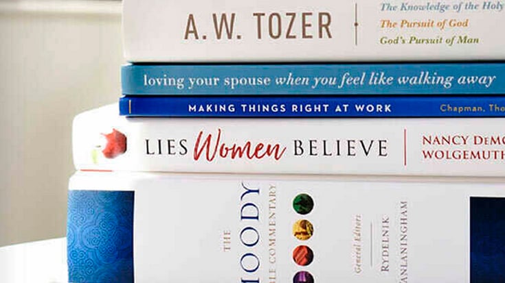 Stack of Moody Publishers books including The Moody Bible Commentary, Lies Women Believe, Making Things Right at Work, and more
