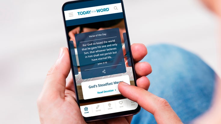 A Today in the Word reader uses the Mobile App to read the Verse of the Day and Daily Devotional