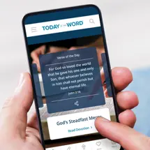 A person holding their phone and using the Today in the Word App