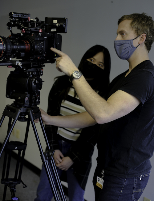 Students learn new techniques while working alongside film and production professionals on the set of the documentary.