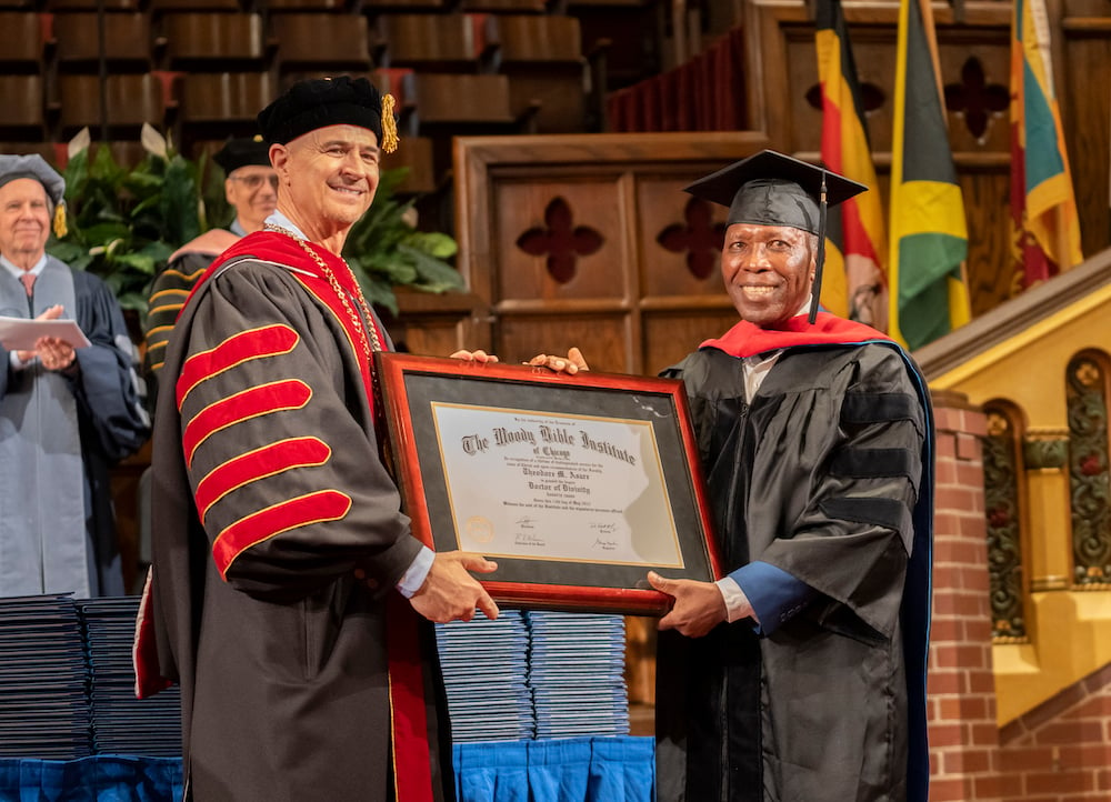 Stephen Asare receiving his honorary doctorate from President Mark Jobe